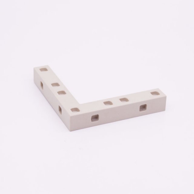 Playmobil 30267600 Verbindingsstuk Hoek - Connecting Strip Corner ,  groot uit kunststof in de kleur l.grijs. Geschikt vanaf 3+.