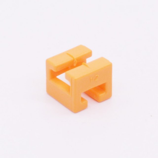 Playmobil 30043543 Geleidingblok - Rachet Arm Bracket ,  groot uit kunststof in de kleur oranje. Geschikt vanaf 3+.